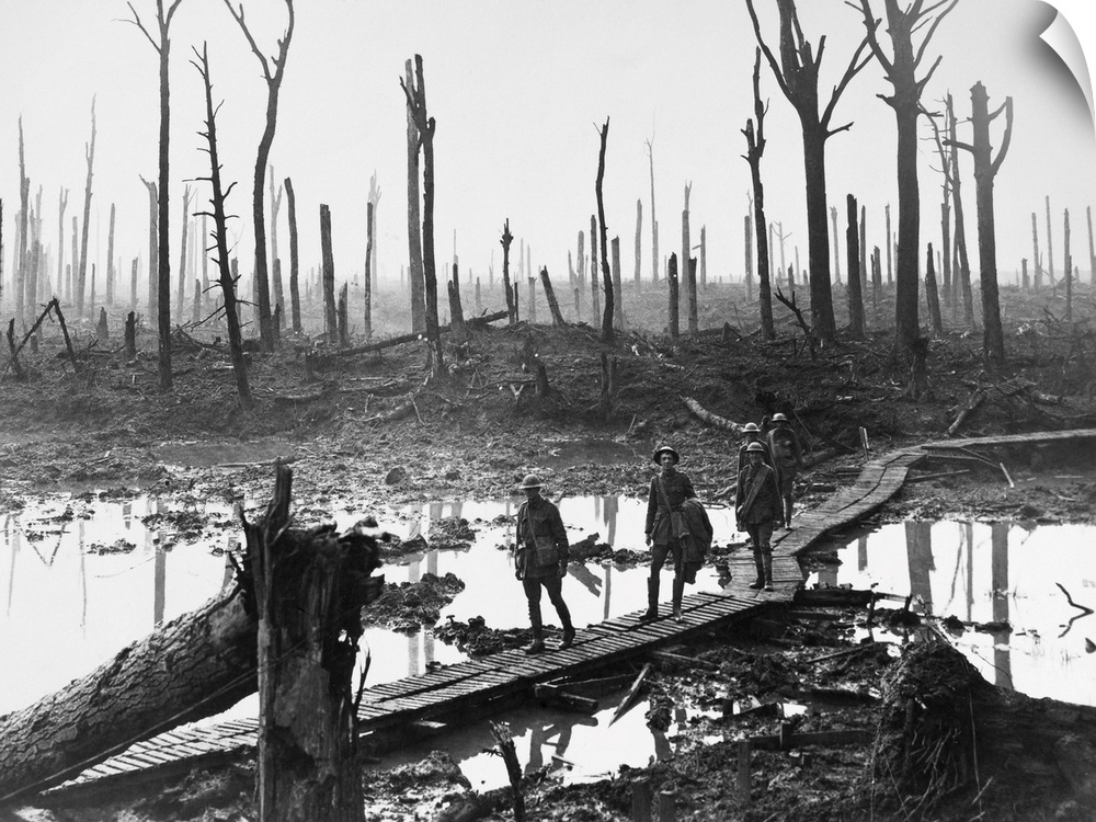 Australian troops walking along duckboards through the remains of Chateau Wood, during the Battle of Passchendaele in Belg...