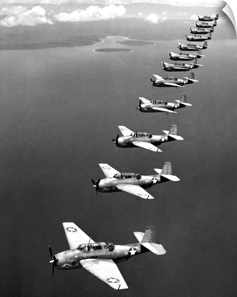 A flight of twelve Grumman 'Avenger' torpedo-bombers over the South Pacific, 1943, during World War II.