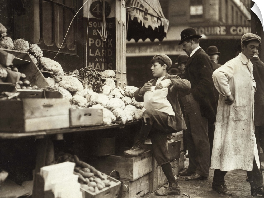 Hine, Produce Stand, 1909. A Boy Working At A Produce Stand In Boston, Massachusetts. Photograph By Lewis Wickes Hine, 1909.