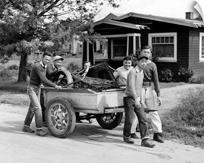 Boys collecting scrap metal for the war effort in San Juan Bautista, California, 1942
