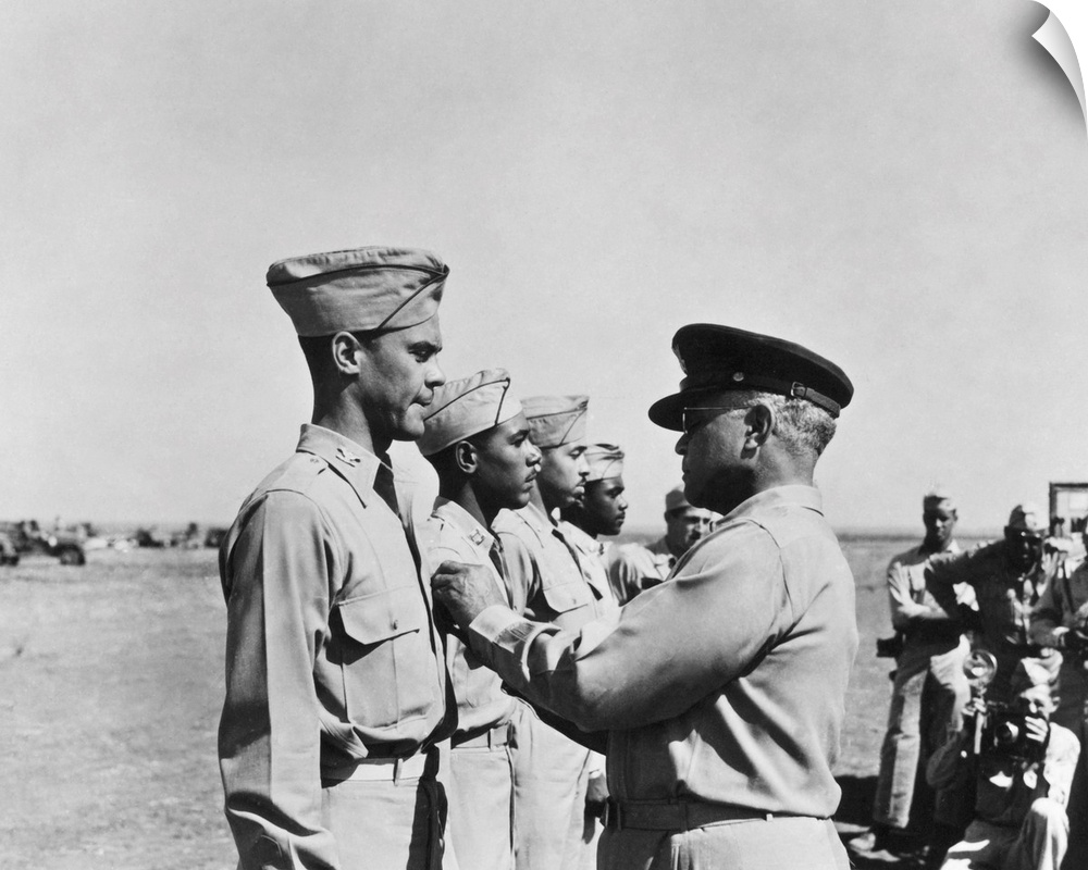 Brigadier General Benjamin Oliver Davis, Sr. pins the Distinguished Flying Cross on his son, Benjamin O. Davis, Jr., while...