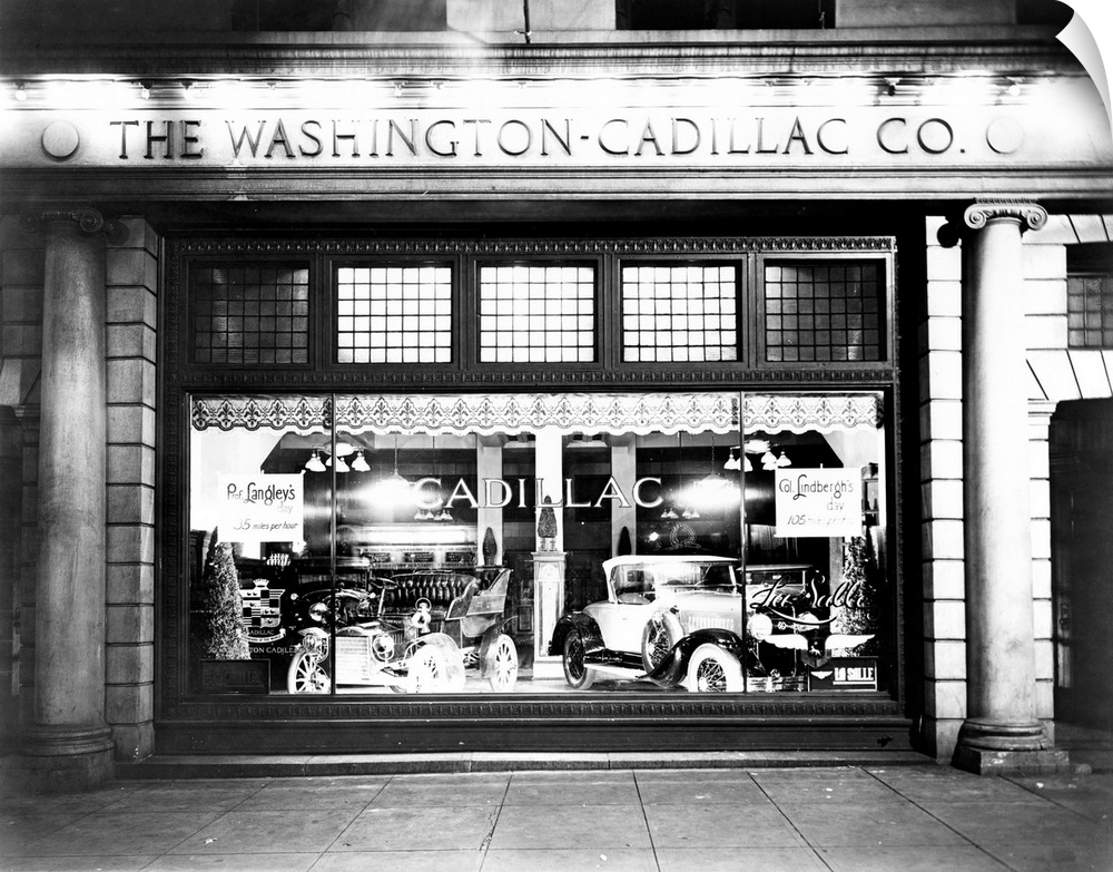 Cadillac automobiles in a store window in Washington, D.C., 1927.