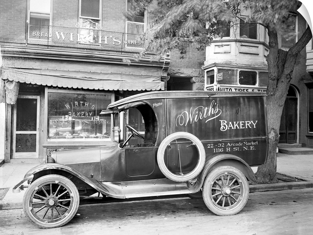 A car with an advertisement for Wirth's Bakery in front of the store on H Street in Washington, D.C., c1915.