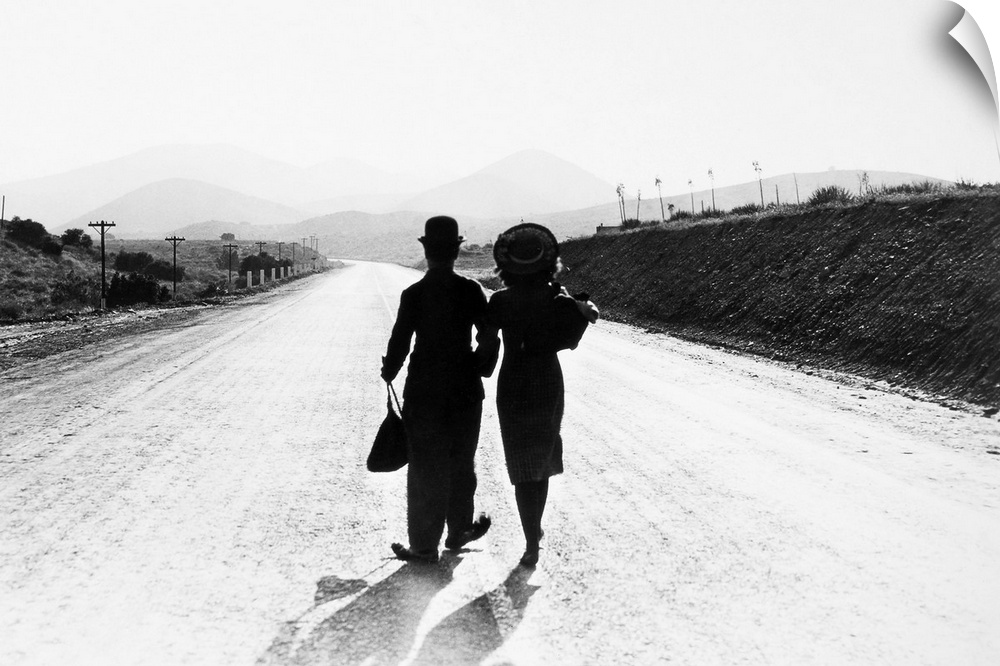 Charlie Chaplin and Paulette Goddard in the final scene from the film, 'Modern Times,' 1936.