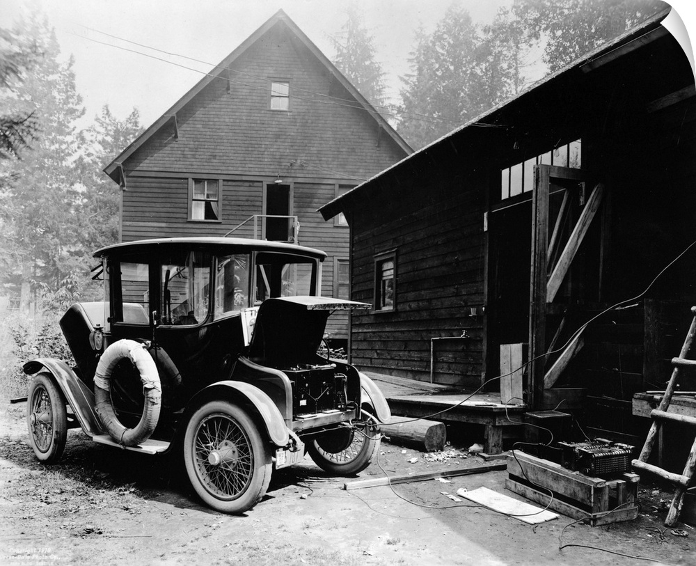 Charging the battery of a Detroit Electric automobile. Photograph, c1919.