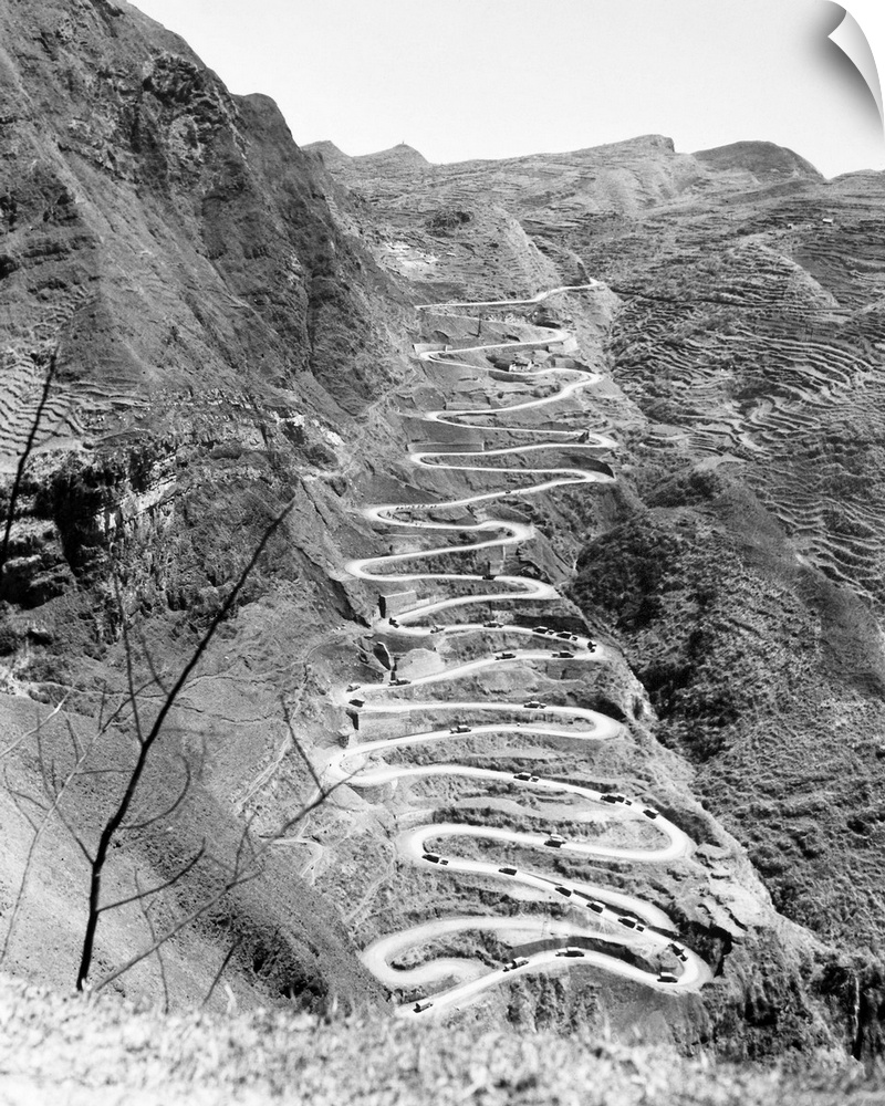 A U.S. military convoy drives on the switchbacks of Ledo Road at Annan, China, during World War II. Photographed 26 March ...