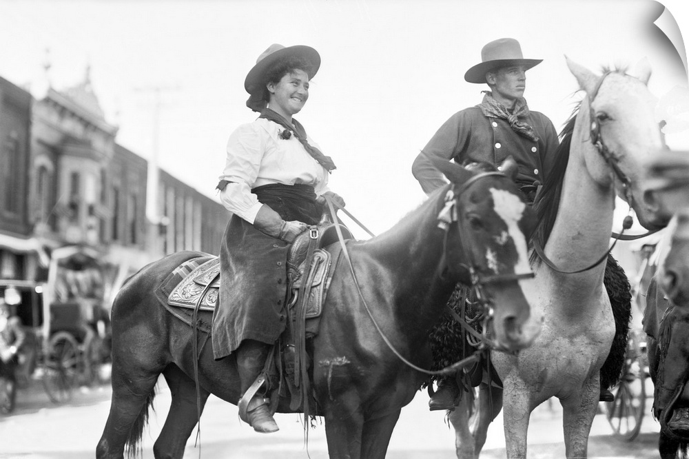 Cowboy And Cowgirl, C1908. A Cowgirl And Cowboy On Horseback In Newton, Kansas. Photograph, C1908.