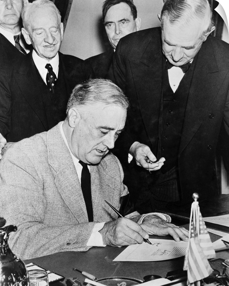 President Franklin D. Roosevelt signing the Declaration of War against Germany, December 1941.