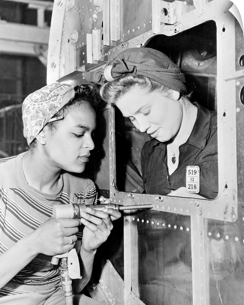 Two women at work at the Douglas Aircraft Company factory in California, during World War II.
