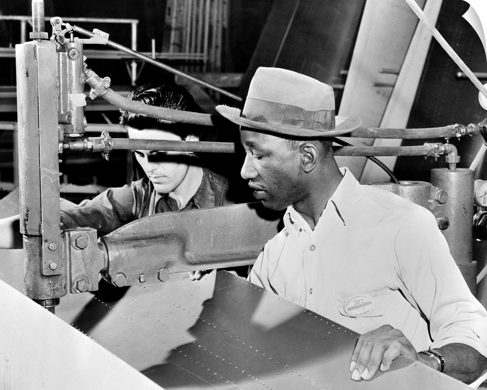 An African-American and Asian-American at work at the Douglas Aircraft factory in Los Angeles, California, during World Wa...