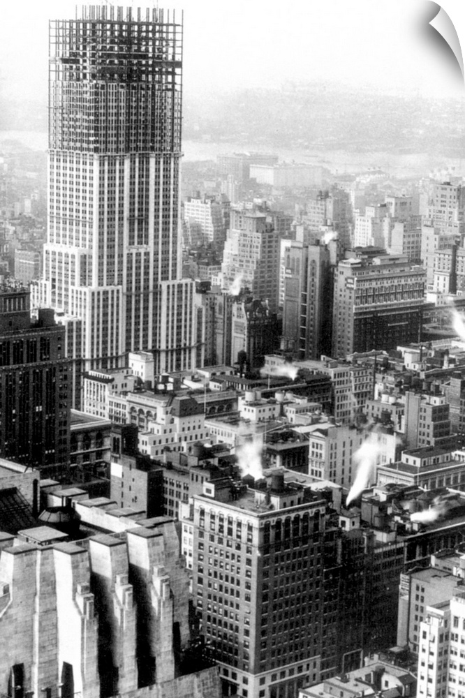 The Empire State Building, New York City, midway through its construction. Photographed in the fall of 1930 by Lewis Hine.