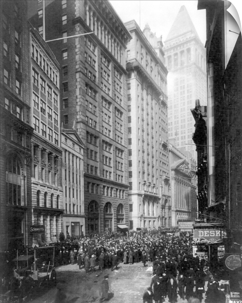 Crowd of men involved in curb exchange trading on Broad Street, New York City. Photograph, c1920.