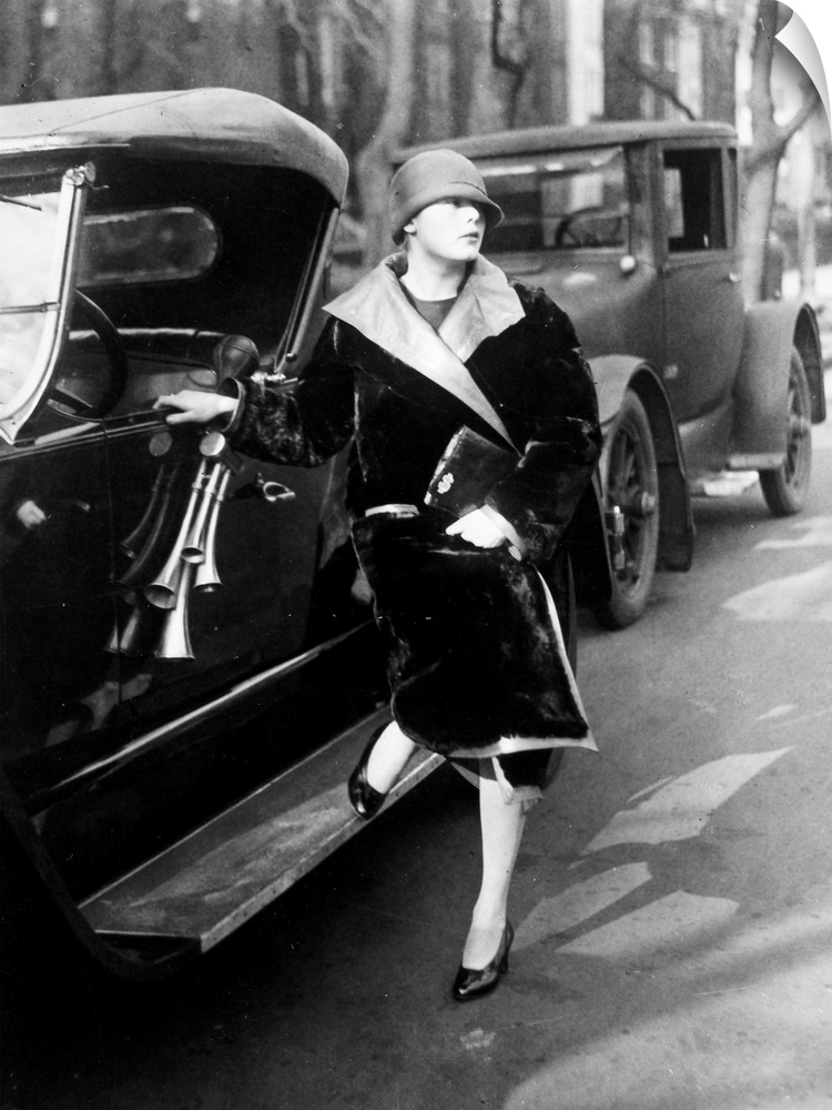 Suzette Dewey, daughter of Assistant Secretary to the Treasury Charles Dewey, beside her roadster, Washington, D.C., 1926.