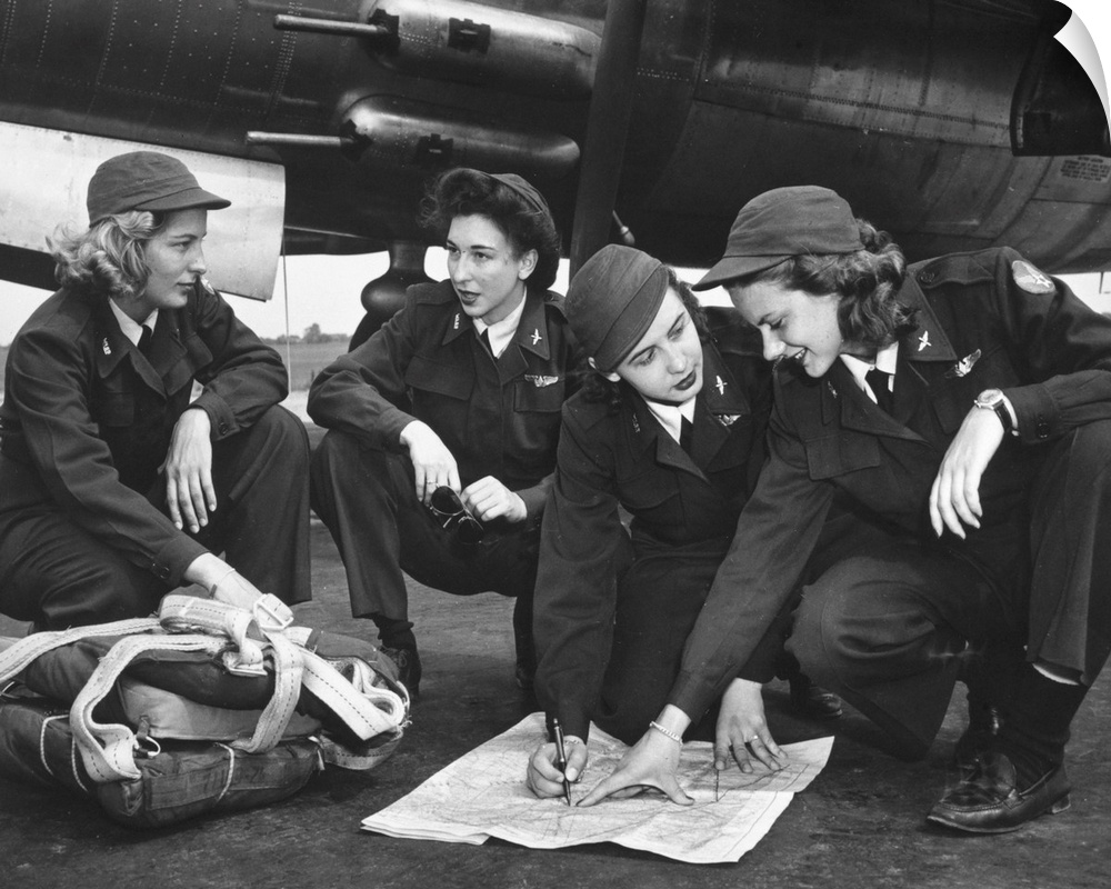 Four female pilots looking at a chart. Photograph, c1941.
