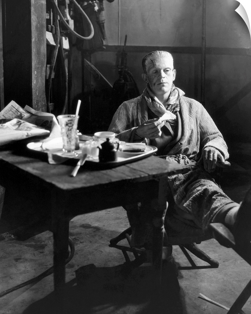 Boris Karloff still in makeup as the Monster, having lunch on the stage set of 'Frankenstein', 1931.