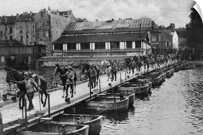 French cavalrymen leading their horses over a pontoon bridge, World War I