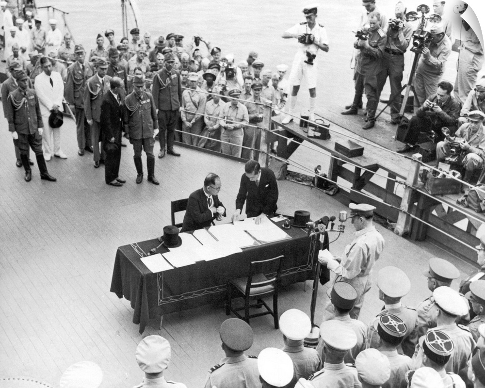 General Douglas MacArthur pauses at the microphone as Japanese Foreign Minister Mamoru Shigemitsu reaches for his pen to s...