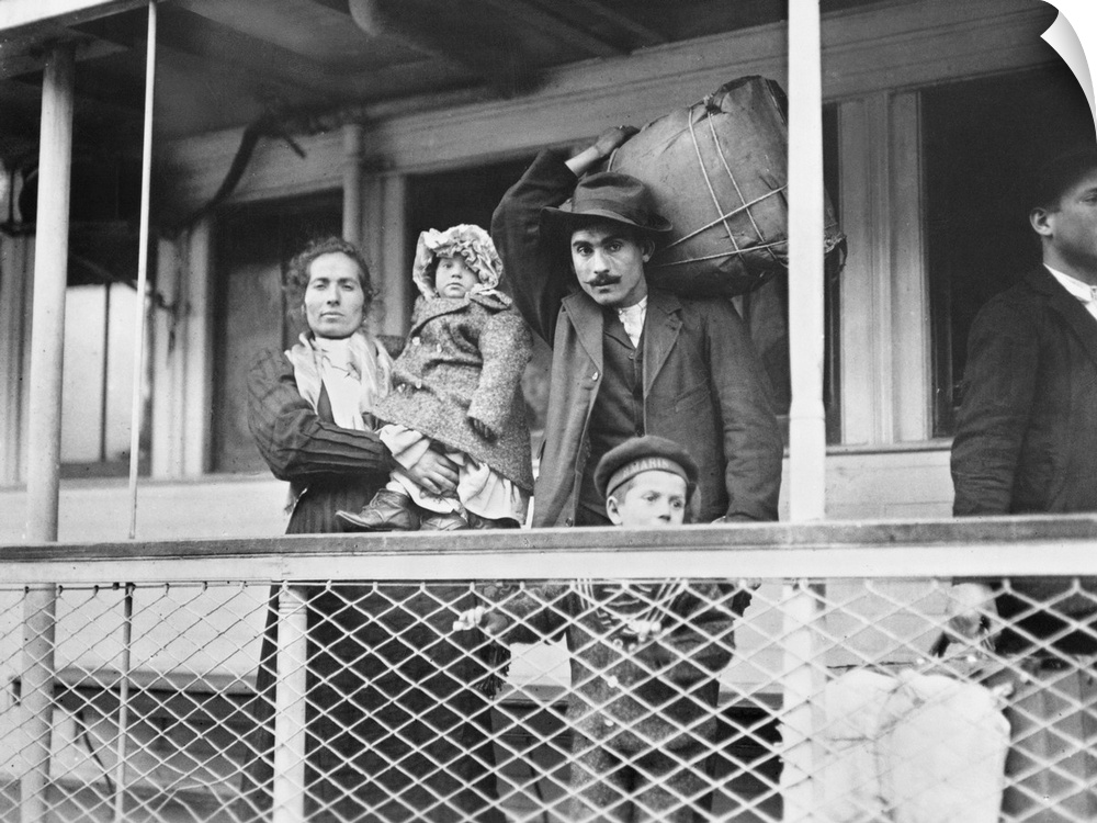 A family of Italian immigrants on board the Ellis Island ferry to Manhattan. Photograph by Lewis Hine, c1905.