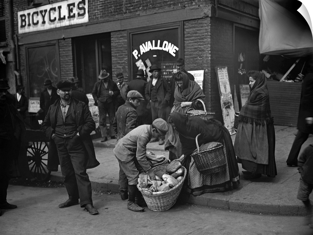 Italian peddlers selling bread on Mulberry Street in New York City. Photograph, c1900.