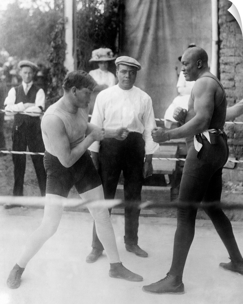 American heavyweight pugilist. Johnson, right, fights Marty Cutler at Las Vegas, New Mexico, in 1914. Johnson's trainer To...