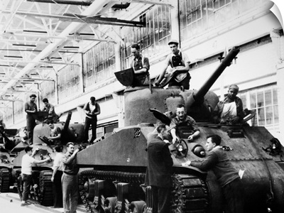 Mechanics working on M-4 tanks at a Ford Motor Company munitions plant, 1942