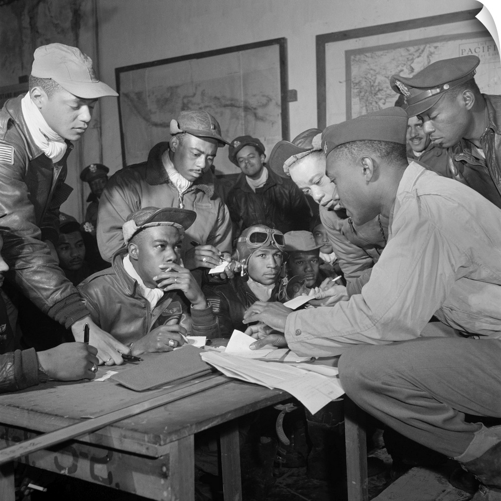 Members of the Tuskegee Airmen in a meeting at Ramitelli, Italy. Front row seated, left to right: unidentified; Jimmie Whe...