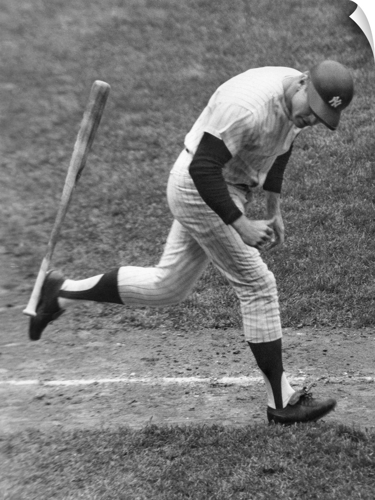 American baseball player. As a member of the New York Yankees, tossing his bat aside and beginning his trot around the bas...