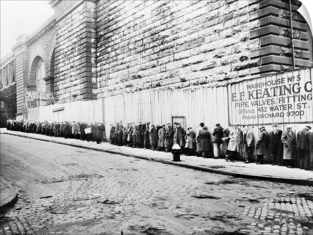 Unemployed workers in a New York City bread line beside the Brooklyn Bridge approach. Photograph, c1930-1935.