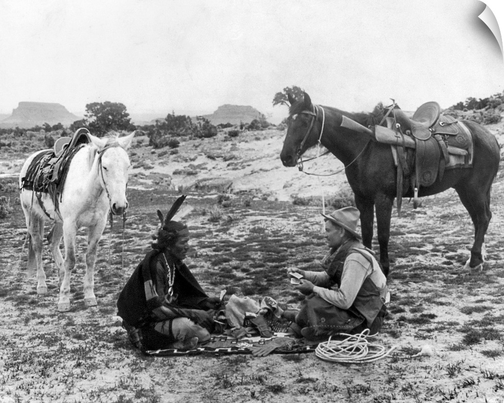 Playing Cards, C1915. A Cowboy And A Native American Man Seated On A Blanket And Playing Cards On the Great Plains. Photog...
