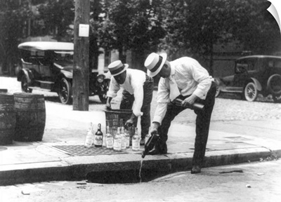Prohibition, 1920's, Men pouring bootleg whiskey into a sewer