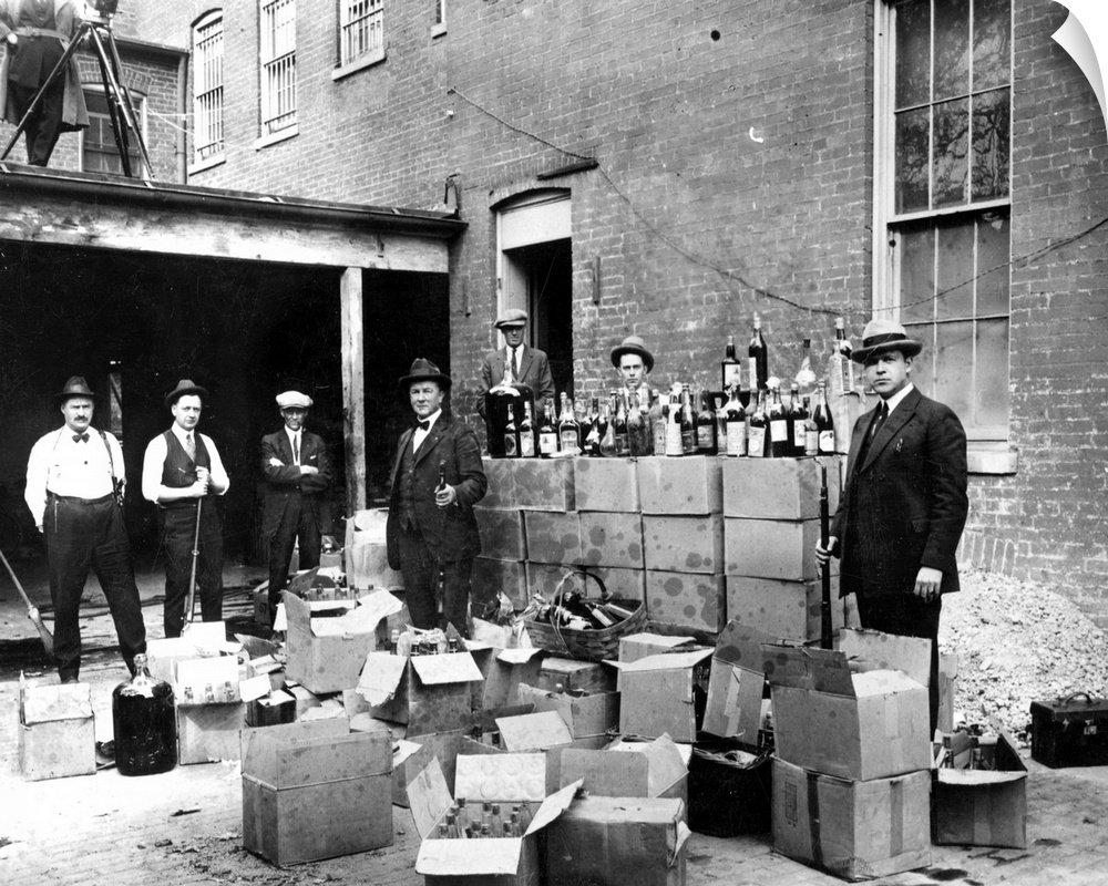 Revenue agents with confiscated bootleg liquor at Washington, D.C., Oct. 14, 1922.