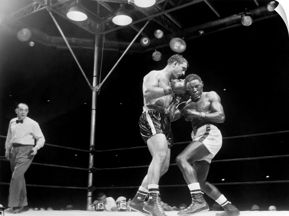 Rocky Marciano (left) defending his heavyweight title in a fight against Ezzard Charles at Yankee Stadium in the Bronx, Ne...