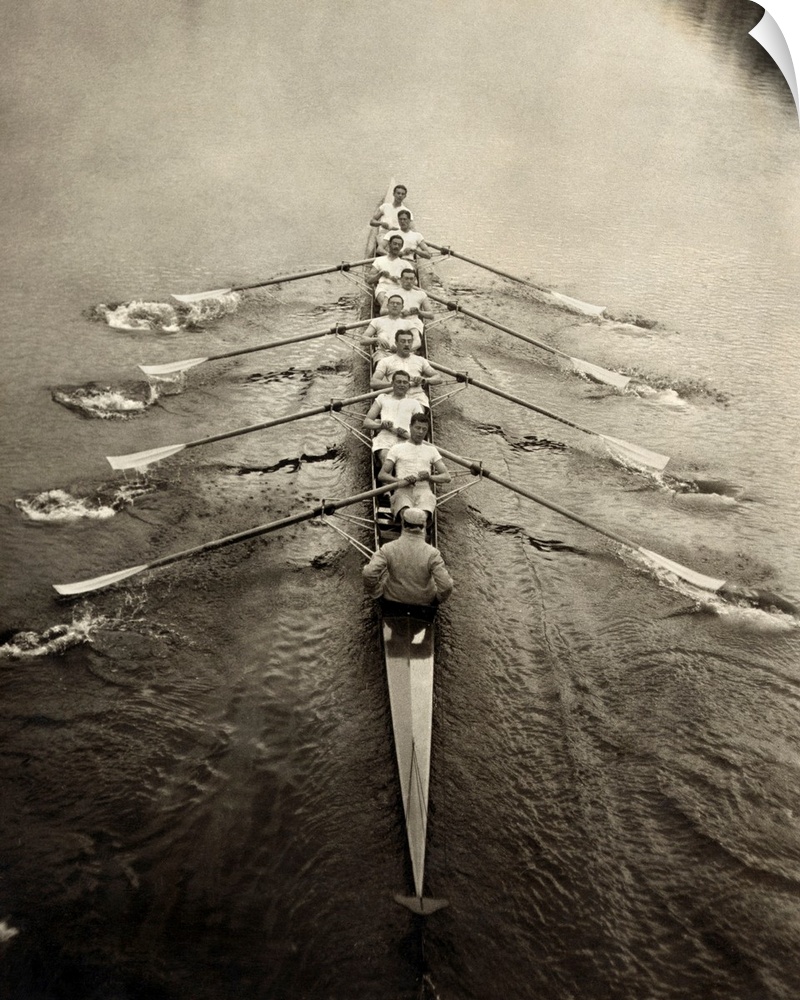 The Cambridge rowing team on a river. Photograph, c1913.