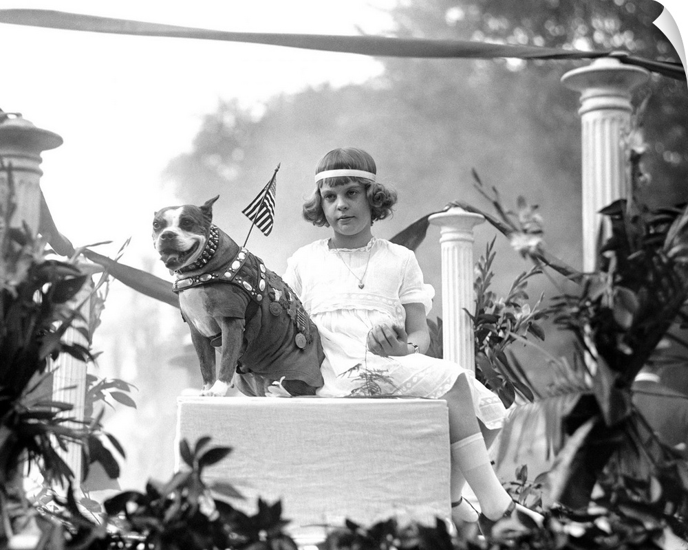 Sergeant Stubby, the most decorated war dog of World War I, riding on a parade float with Louise Johnson in Washington D.C...