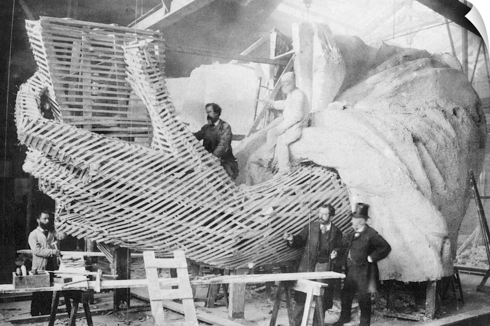 The Statue of Liberty under construction in Paris, c1883. Its sculptor, Frederic Bartholdi, stands second from right.