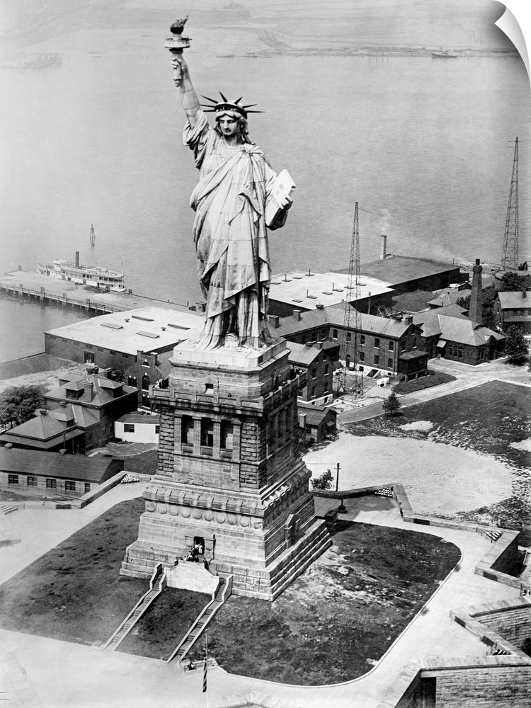 The Statue of Liberty on Liberty Island in the New York Harbor seen from an army plane. Photograph, late 19th or early 20t...