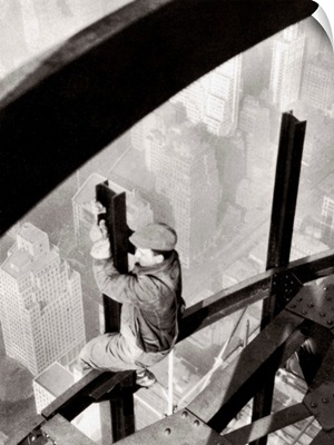 Steelworker atop the Empire State Building, New York City, during its construction, 1931