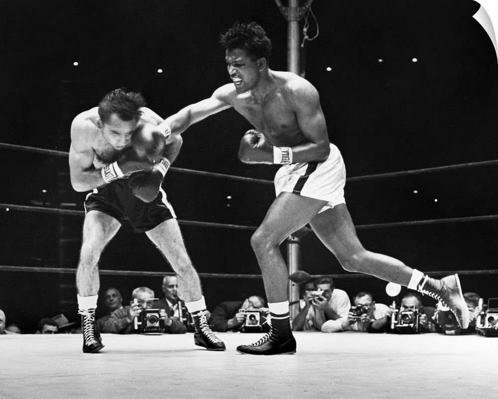 (1921-1989). N? Walker Smith, Jr. Robinson (right) during the seventh round of a fight against Carmen Basilio, 1957.