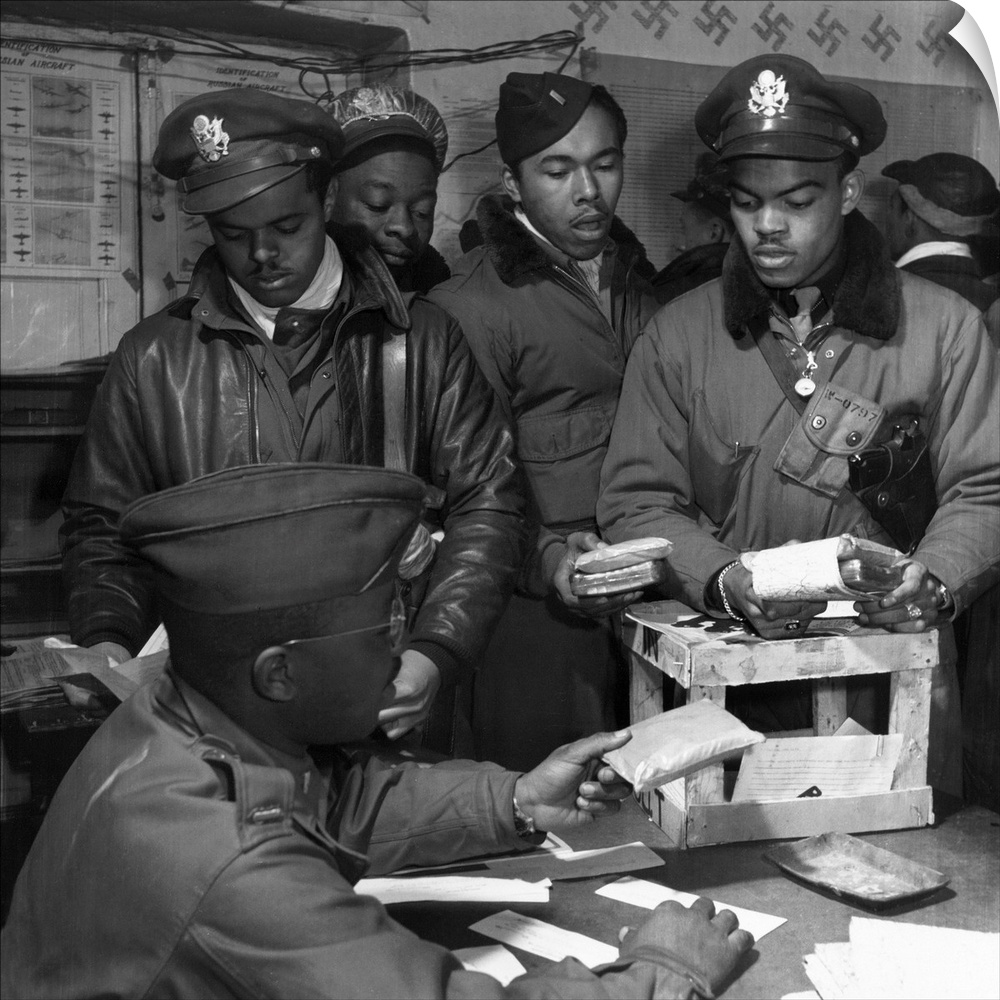 Fighter pilots of the Tuskegee Airmen 332nd Fighter Group receive 'Escape kits' (cyanide) at Ramitelli Airfield, Italy. Ph...