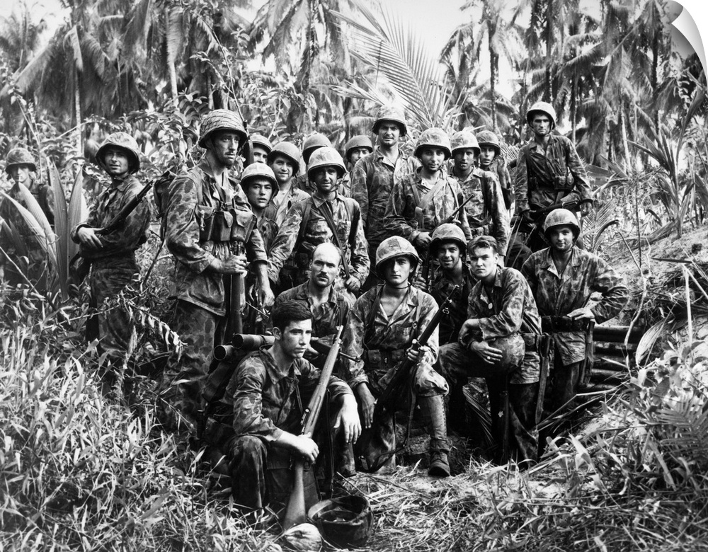 U.S. Marine Raiders posing in front of a Japanese dugout which they helped capture at Cape Torokina, Bougainville, New Gui...