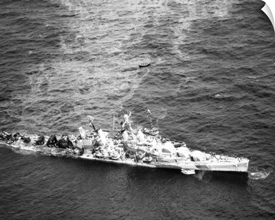 USS Reno after being torpedoed, photographed alongside the USS Zuni, 1944
