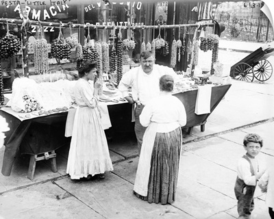 Women shopping at a street vendor's table in Little Italy, New York City, c1905