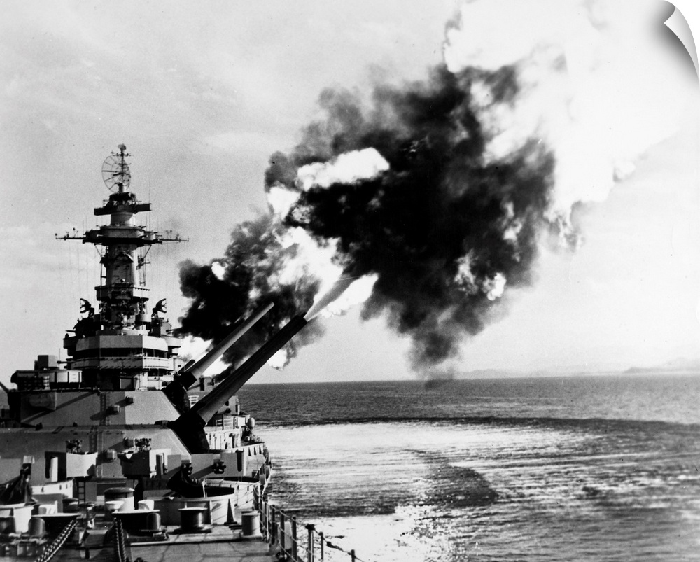 An American battleship firing its guns during World War II.