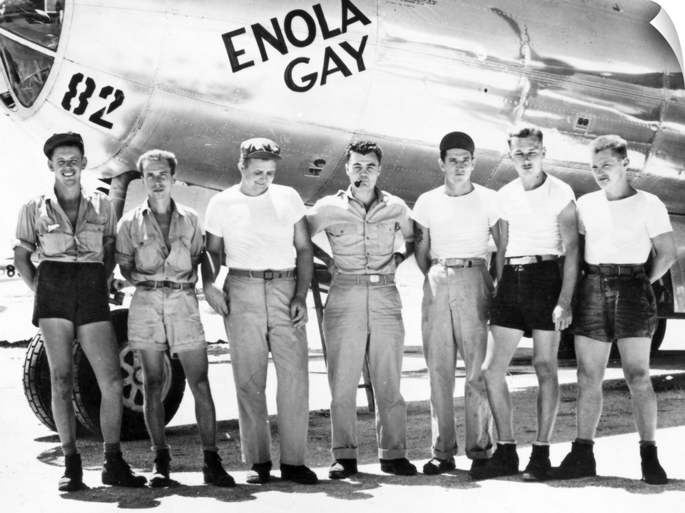 Colonel Paul W. Tibbets (center) and ground crew of the B-29 'Enola Gay' which dropped the first atomic bomb on Hiroshima,...