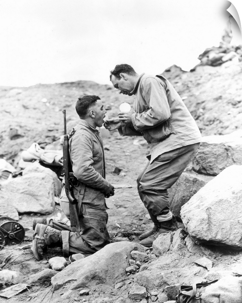 An United States Marine receiving Communion on Iwo Jima, 1945.