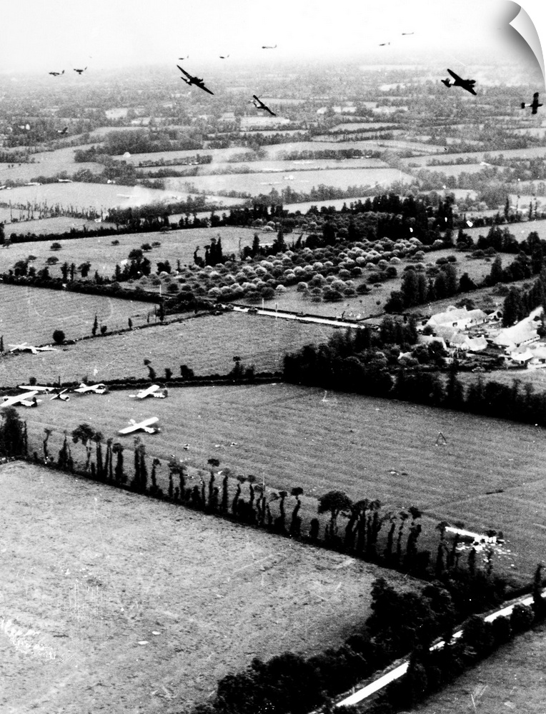 Gliders of the U.S. Ninth Air Force land in Normandy, France, during the D-Day invasion, 6 June 1944. Some gliders have al...