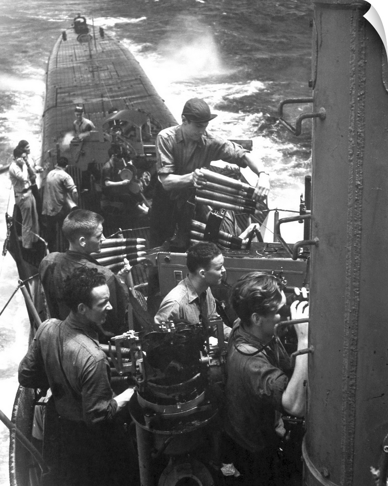 Crew members aboard a U.S. submarine practice firing as they return to base from a successful war patrol, 1945.