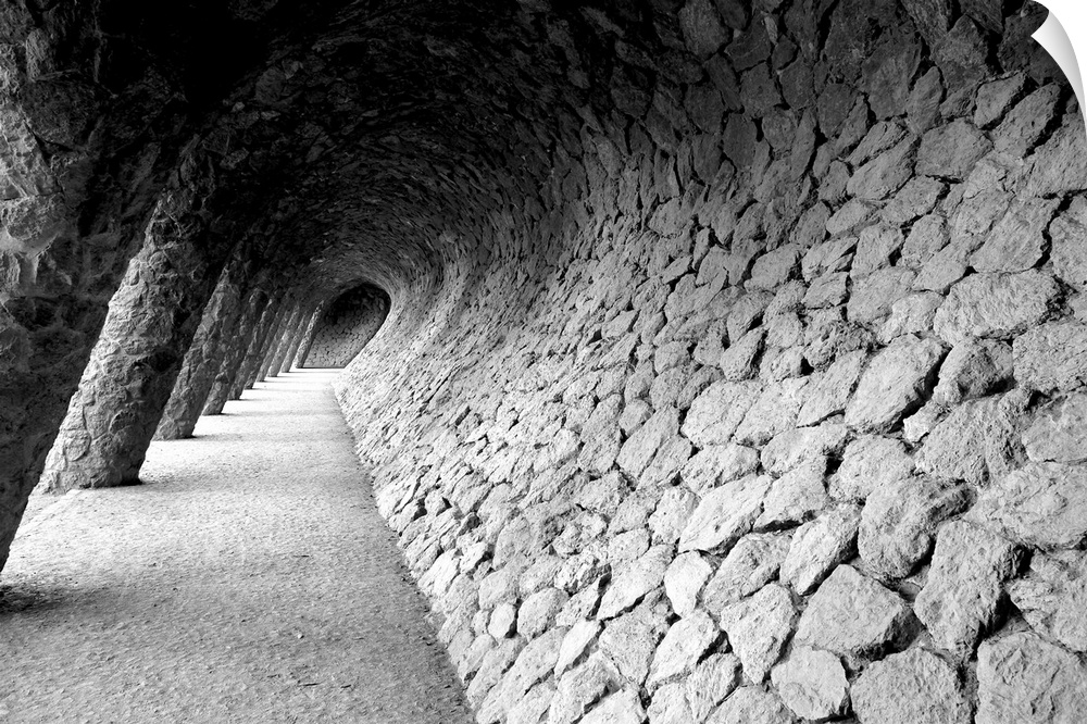 Black and white photograph of a distorted stone wall pathway.