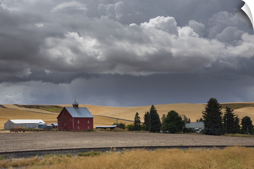 Dark storm clouds over a red barn in Palouse, Washington.