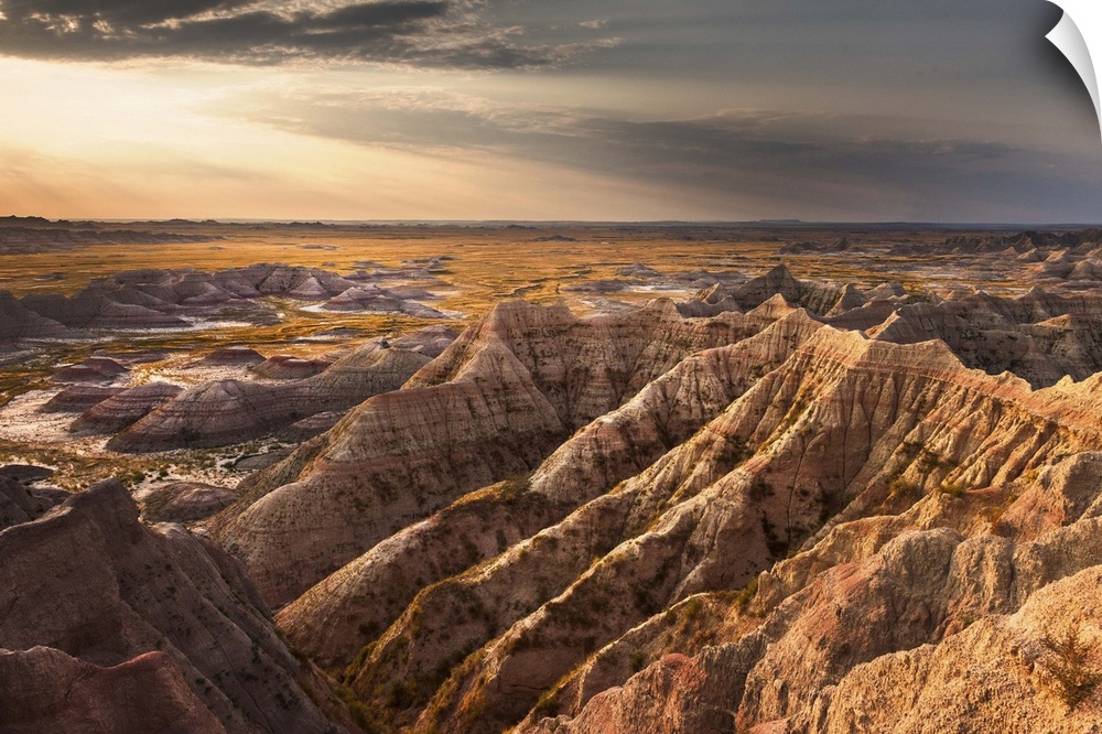 Beams of sunlight shining on the rugged landscape of the South Dakota Badlands in the morning.